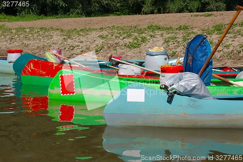 Image of Canoes on the Riverside