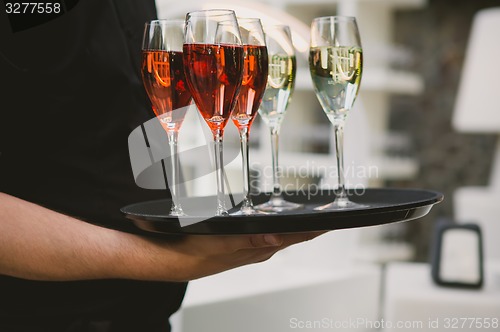 Image of Waiter serving champagne 