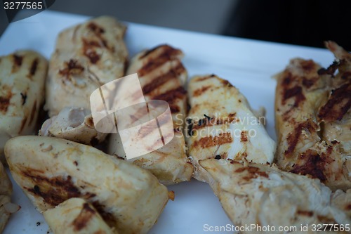 Image of Meat on BBQ. Shallow DOF.