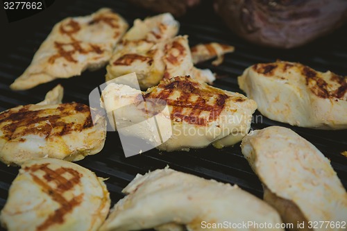 Image of Meat on BBQ. Shallow DOF.