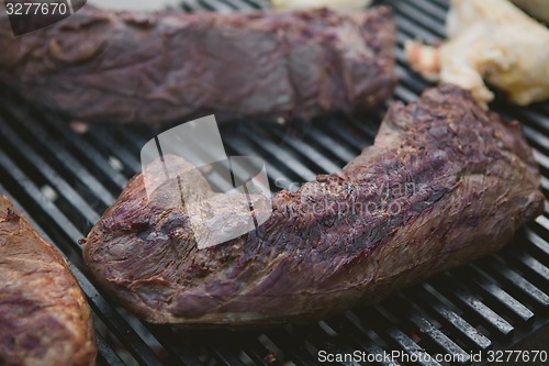 Image of Meat on BBQ. Shallow DOF.