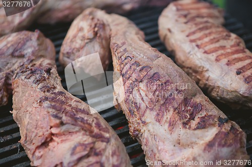 Image of Meat on BBQ. Shallow DOF.