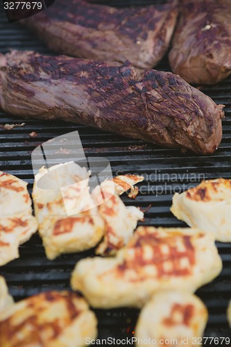 Image of Meat on BBQ. Shallow DOF.