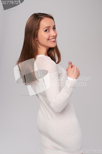 Image of Woman gesturing thumb up