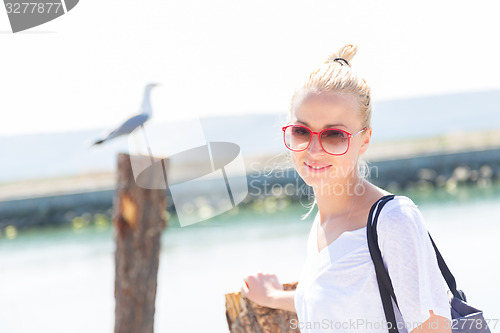 Image of Woman on the beach in summertime.