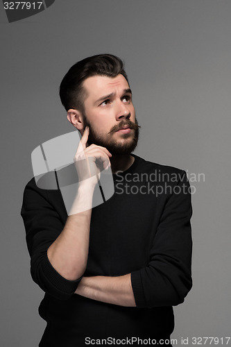 Image of Fashion portrait of young man in black 