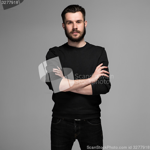 Image of Fashion portrait of young man in black 