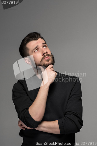 Image of Fashion portrait of young man in black 