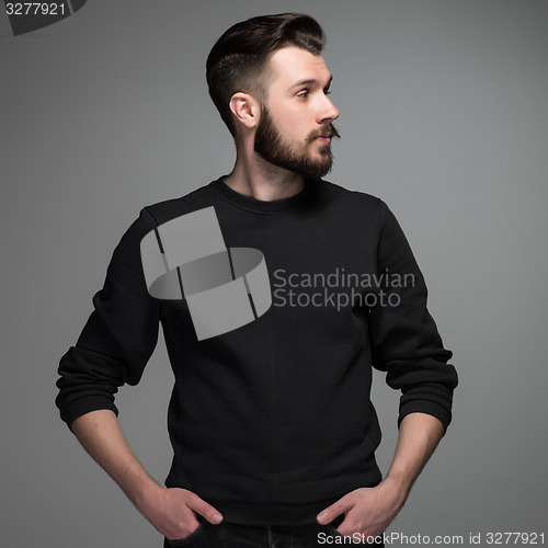 Image of Fashion portrait of young man in black 