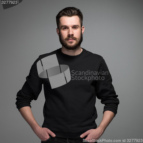Image of Fashion portrait of young man in black 