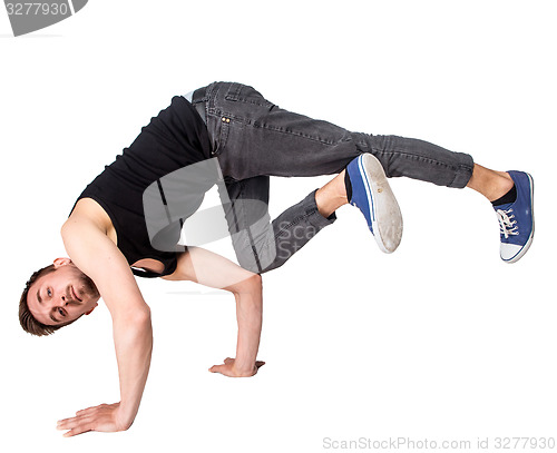 Image of Break dancer doing handstand against  white background