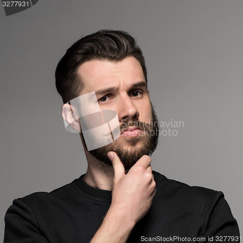 Image of Fashion portrait of young man in black 