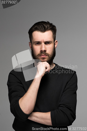 Image of Fashion portrait of young man in black 