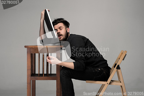 Image of Businessman sleeping on a computer