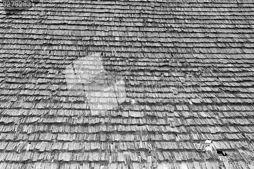 Image of damaged traditional shingle roof