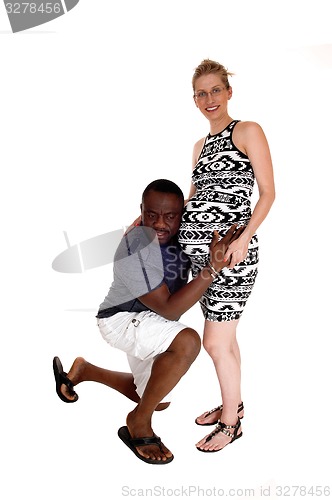 Image of Black man with pregnant Caucasian wife.
