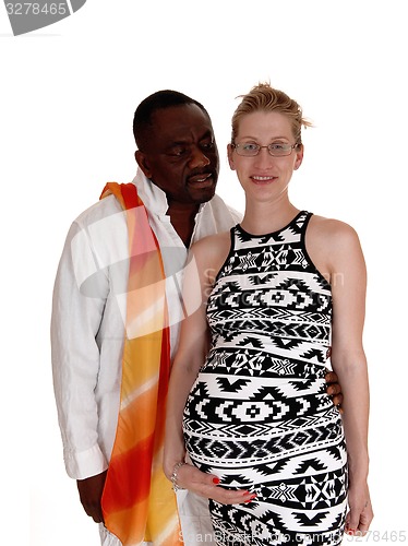 Image of Black man whit his pregnant white woman.