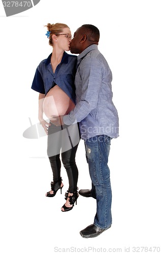 Image of Black man kissing his pregnant white woman.