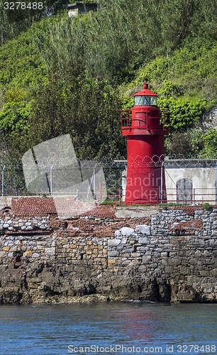 Image of Little lighthouse on a rocky shore