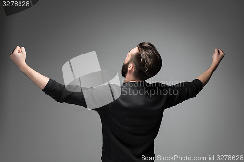 Image of Back portrait of a very happy man