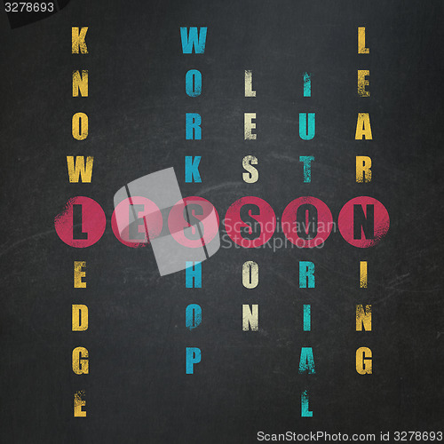 Image of Learning concept: word Lesson in solving Crossword Puzzle