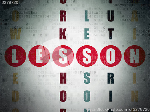 Image of Studying concept: word Lesson in solving Crossword Puzzle