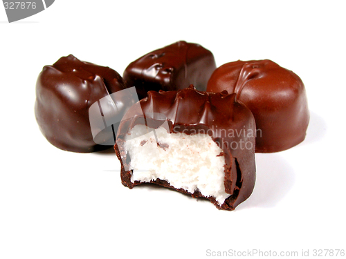 Image of Chocolates on white, one bitten