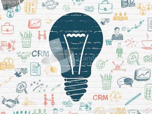 Image of Finance concept: Light Bulb on wall background