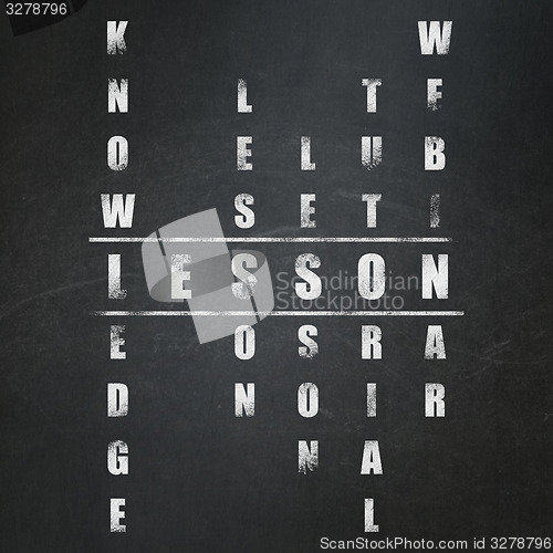 Image of Education concept: word Lesson in solving Crossword Puzzle