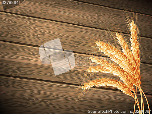 Image of Wheat on wooden background. EPS 10 