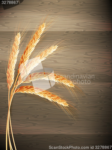 Image of Wheat on wooden background. EPS 10 