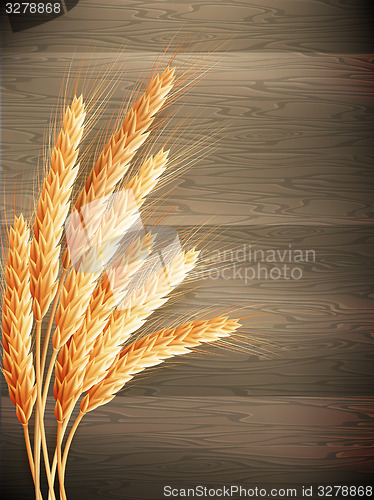 Image of Wheat on wooden background. EPS 10 