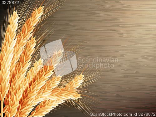 Image of Wheat on wooden background. EPS 10 