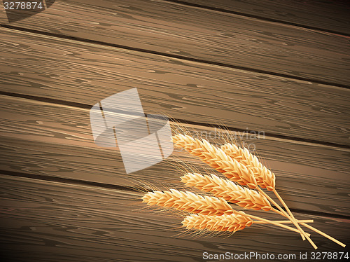 Image of Wheat on wooden background. EPS 10 