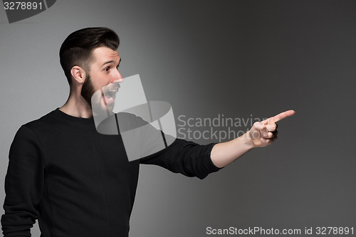 Image of Excited man pointing a great idea - over gray background