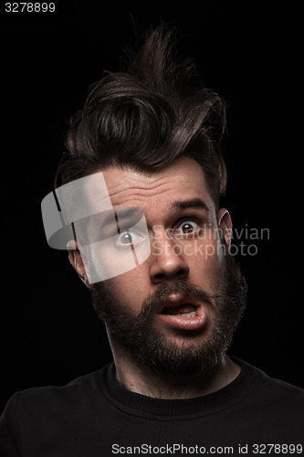 Image of Portrait of young crazy man in studio