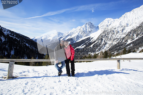 Image of Happy couple in winter landscape 