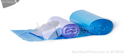 Image of Blue and violet rolls of plastic garbage bags