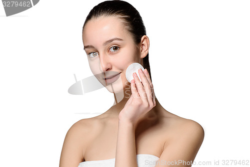 Image of skin care woman removing face with cotton swab pad