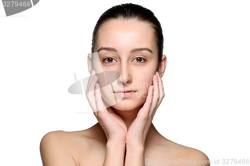 Image of Portrait of beautiful girl stroking her face with healthy skin 