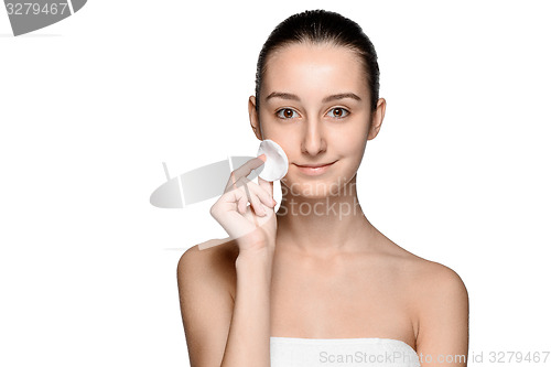 Image of skin care woman removing face with cotton swab pad