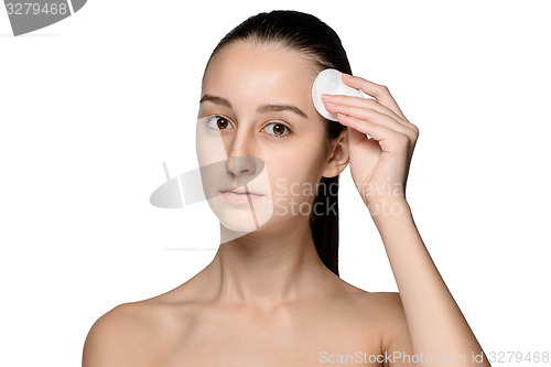 Image of skin care woman removing face with cotton swab pad