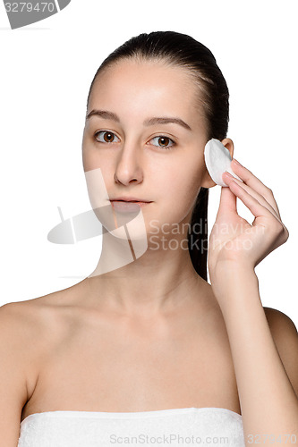 Image of skin care woman removing face with cotton swab pad