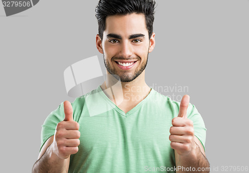 Image of Handsome man with thumbs up