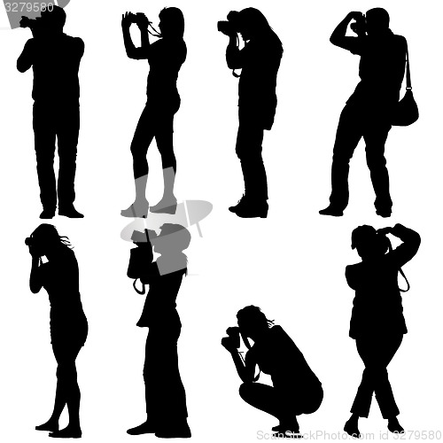 Image of Cameraman with video camera. Silhouettes on white background. 