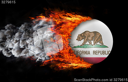 Image of Flag with a trail of fire and smoke - California