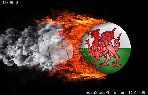 Image of Flag with a trail of fire and smoke - Wales