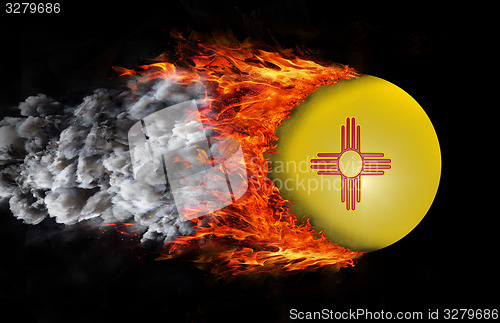 Image of Flag with a trail of fire and smoke - New Mexico