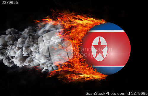 Image of Flag with a trail of fire and smoke - North Korea