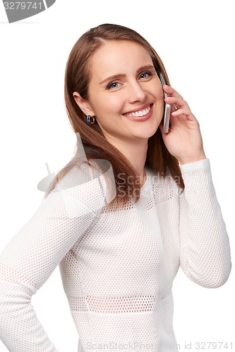 Image of Happy woman talking on cell phone